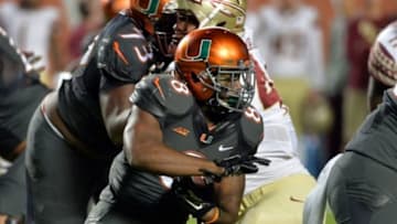 Nov 15, 2014; Miami Gardens, FL, USA; Miami Hurricanes running back Duke Johnson (8) runs against Florida State Seminoles during the first half at Sun Life Stadium. Mandatory Credit: Steve Mitchell-USA TODAY Sports