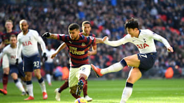 LONDON, ENGLAND - FEBRUARY 02: Heung-Min Son of Tottenham Hotspur shoots while challanged by Deandre Yedlin of Newcastle United during the Premier League match between Tottenham Hotspur and Newcastle United at Wembley Stadium on February 2, 2019 in London, United Kingdom. (Photo by Michael Regan/Getty Images)