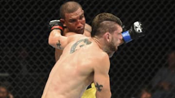 BOISE, ID - JULY 14: (L-R) Raoni Barcelos of Brazil punches Kurt Holobaugh in their featherweight fight during the UFC Fight Night event inside CenturyLink Arena on July 14, 2018 in Boise, Idaho. (Photo by Josh Hedges/Zuffa LLC/Zuffa LLC via Getty Images)