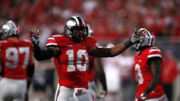Sep 28, 2013; Columbus, OH, USA; Ohio State Buckeyes linebacker Ryan Shazier (10) pumps up the crowd during the fourth quarter against the Wisconsin Badgers at Ohio Stadium. Buckeyes beat the Badgers 31-24. Mandatory Credit: Raj Mehta-USA TODAY Sports