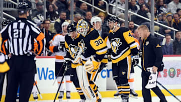 PITTSBURGH, PA - NOVEMBER 27: Pittsburgh Penguins Goalie Matt Murray (30) after suffering an apparent injury is helped off the ice by Pittsburgh Penguins Center Sidney Crosby (87) (left) and Pittsburgh Penguins Defenseman Justin Schultz (4) (right) during the second period in the NHL game between the Pittsburgh Penguins and the Philadelphia Flyers on November 27, 2017, at PPG Paints Arena in Pittsburgh, PA. (Photo by Jeanine Leech/Icon Sportswire via Getty Images)