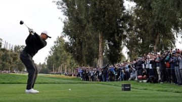PACIFIC PALISADES, CALIFORNIA - FEBRUARY 17: Tiger Woods of the United States plays his shot from the 11th tee during the second round of the The Genesis Invitational at Riviera Country Club on February 17, 2023 in Pacific Palisades, California. (Photo by Harry How/Getty Images)