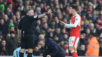 LONDON, ENGLAND - JANUARY 22: Granit Xhaka (2nd L) of Arsenal protests to referee Jonathan Moss after shown a red card during the Premier League match between Arsenal and Burnley at the Emirates Stadium on January 22, 2017 in London, England. (Photo by Shaun Botterill/Getty Images)