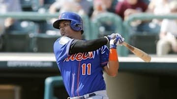 Mar 8, 2016; Lake Buena Vista, FL, USA; New York Mets shortstop Ruben Tejada (11) bats during the first inning of a spring training baseball game against the Atlanta Braves at Champion Stadium. Mandatory Credit: Reinhold Matay-USA TODAY Sports