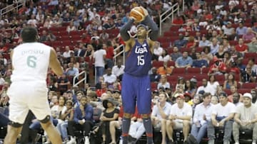 Aug 1, 2016; Houston, TX, USA; United States forward Carmelo Anthony (15) shoots against Nigeria forward Ike Diogu (6) in the second quarter during an exhibition basketball game at Toyota Center. United States won 110 to 66. Mandatory Credit: Thomas B. Shea-USA TODAY Sports
