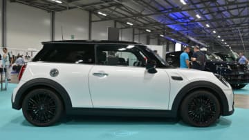 FARNBOROUGH, ENGLAND - AUGUST 17: A MINI Cooper S is displayed during the British Motor Show at Farnborough International Exhibition Centre on August 17, 2023 in Farnborough, England. The family-friendly automotive show features supercar parades, stunt shows, live auctions, expert advice on sustainable motoring options and gives visitors the chance to test drive the latest models. (Photo by John Keeble/Getty Images)