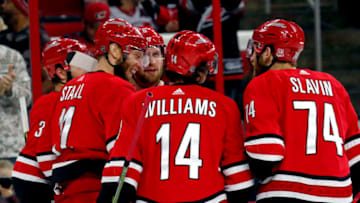 The Carolina Hurricanes' Jordan Staal (11) celebrates his goal with teammates Justin Williams (14) and Jaccob Slavin (74) during the first period against the Tampa Bay Lightning at PNC Arena in Raleigh, N.C., on Saturday, April 7, 2018. (Chris Seward/Raleigh News & Observer/Tribune News Service via Getty Images)