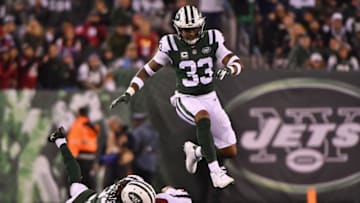 EAST RUTHERFORD, NJ - DECEMBER 15: Strong safety Jamal Adams #33 of the New York Jets leaps over teammate cornerback Darryl Roberts #27 and wide receiver Demaryius Thomas #87 of the Houston Texans during the second quarter at MetLife Stadium on December 15, 2018 in East Rutherford, New Jersey. The Houston Texans won 29-22. (Photo by Mark Brown/Getty Images)