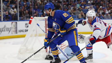 Oct 12, 2023; Buffalo, New York, USA; Buffalo Sabres right wing Alex Tuch (89) looks to make a pass as New York Rangers defenseman Braden Schneider (4) defends during the third period at KeyBank Center. Mandatory Credit: Timothy T. Ludwig-USA TODAY Sports
