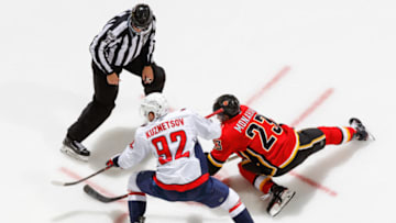 CALGARY, AB - OCTOBER 29: Evgeny Kuznetsov #92 of the Washington Capitals and Sean Monahan #23 of the Calgary Flames at face off in an NHL game against the Washington Capitals at the Scotiabank Saddledome on October 29, 2017 in Calgary, Alberta, Canada. (Photo by Gerry Thomas/NHLI via Getty Images)