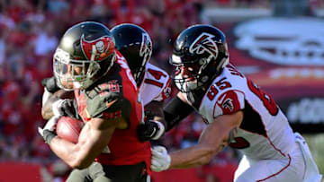 TAMPA, FLORIDA - DECEMBER 30: Andrew Adams #26 of the Tampa Bay Buccaneers intercepts Matt Ryan #2 of the Atlanta Falcons during the fourth quarter at Raymond James Stadium on December 30, 2018 in Tampa, Florida. The Falcons won 34-32. (Photo by Julio Aguilar/Getty Images)