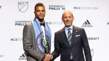 Jan 15, 2015; Philadelphia, PA, USA; Khiry Shelton shakes hands with commissioner Don Garber after being selected as the number two overall pick by New York City FC in the 2015 MLS SuperDraft at Philadelphia Convention Center. Mandatory Credit: Bill Streicher-USA TODAY Sports