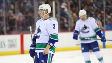 SPOKANE, WASHINGTON - SEPTEMBER 26: Tucker Poolman #3 of the Vancouver Canucks reacts against the Seattle Kraken in the third period during a preseason game at Spokane Veterans Memorial Arena on September 26, 2021 in Spokane, Washington. (Photo by Abbie Parr/Getty Images)