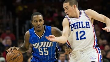 Feb 23, 2016; Philadelphia, PA, USA; Orlando Magic guard Brandon Jennings (55) dribbles up court against the defense of Philadelphia 76ers guard T.J. McConnell (12) during the first quarter at Wells Fargo Center. Mandatory Credit: Bill Streicher-USA TODAY Sports