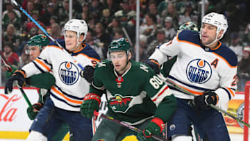 ST. PAUL, MN - APRIL 02: Minnesota Wild Right Wing Nino Niederreiter (22) and Minnesota Wild Defenceman Carson Soucy (60) battle for position with Edmonton Oilers Right Wing Jesse Puljujarvi (98) and Edmonton Oilers Left Wing Milan Lucic (27) during a NHL game between the Minnesota Wild and Edmonton Oilers on April 2, 2018 at Xcel Energy Center in St. Paul, MN. The Wild Defeated the Oilers 3-0.(Photo by Nick Wosika/Icon Sportswire via Getty Images)