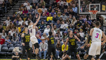 Miami Heat guard Tyler Herro (14) shoots the ball against Utah Jazz guard Mike Conley (11)(Christopher Creveling-USA TODAY Sports)
