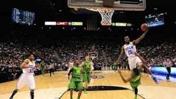 March 16, 2013; Las Vegas, NV, USA; UCLA Bruins guard/forward Shabazz Muhammad (15) commits a charging foul on Oregon Ducks forward Carlos Emory (33) during the first half of the championship game of the Pac 12 tournament at the MGM Grand Garden Arena. Oregon defeated UCLA 78-69. Mandatory Credit: Kyle Terada-USA TODAY Sports
