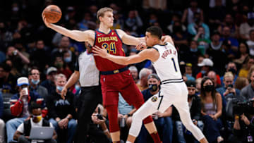 Oct 25, 2021; Denver, Colorado, USA; Cleveland Cavaliers forward Lauri Markkanen (24) looks to pass the ball as Denver Nuggets forward Michael Porter Jr. (1) defends in the first quarter at Ball Arena. Mandatory Credit: Isaiah J. Downing-USA TODAY Sports
