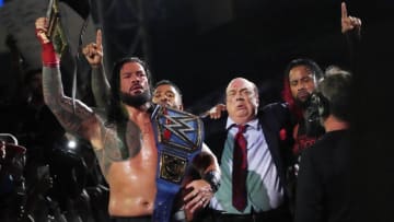 Jul 30, 2022; Nashville, Tennessee, US; Roman Reigns (left) celebrates with the Bloodline after defeating Brock Lesnar in their last man standing match for the Undisputed Championship during SummerSlam at Nissan Stadium. Mandatory Credit: Joe Camporeale-USA TODAY Sports