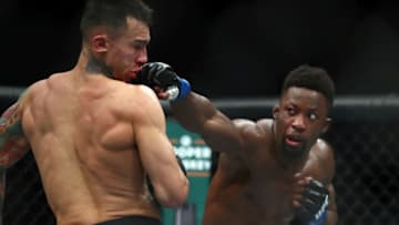 January 18, 2020; Las Vegas, Nevada, USA; Sodiq Yusuff moves in with a hit against Andre Fili during UFC 246 at T-Mobile Arena. Mandatory Credit: Mark J. Rebilas-USA TODAY Sports