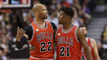Mar 14, 2016; Toronto, Ontario, CAN; Chicago Bulls forward Taj Gibson (22) talks to forward Jimmy Butler (21) against the Toronto Raptors at Air Canada Centre. The Bulls beat the Raptors 109-107. Mandatory Credit: Tom Szczerbowski-USA TODAY Sports