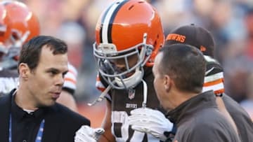 Oct 26, 2014; Cleveland, OH, USA; Cleveland Browns tight end Jordan Cameron (84) is walked off the field after being injured against the Oakland Raiders during the second quarter at FirstEnergy Stadium. The Browns won 23-13. Mandatory Credit: Ron Schwane-USA TODAY Sports