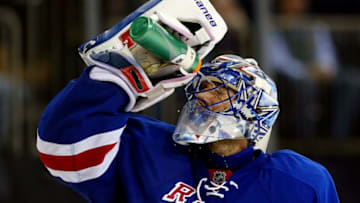 NEW YORK, NY - DECEMBER 23: Henrik Lundqvist #30 of the New York Rangers looks on during a break in play against the Washington Capitals during a game at Madison Square Garden on December 23, 2014 in New York City. (Photo by Alex Trautwig/Getty Images)