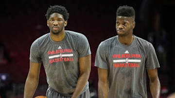 Dec 22, 2015; Philadelphia, PA, USA; Philadelphia 76ers center Joel Embiid (L) and forward Nerlens Noel (R) work out prior to a game against the Memphis Grizzlies at Wells Fargo Center. Mandatory Credit: Bill Streicher-USA TODAY Sports