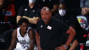 LAKE BUENA VISTA, FLORIDA - AUGUST 09: Head Coach Doc Rivers of the LA Clippers looks on against the Brooklyn Nets in the first half of a NBA basketball game at AdventHealth Arena at the ESPN Wide World Of Sports Complex on August 9, 2020 in Lake Buena Vista, Florida. NOTE TO USER: User expressly acknowledges and agrees that, by downloading and or using this photograph, User is consenting to the terms and conditions of the Getty Images License Agreement. (Photo by Kim Klement-Pool/Getty Images)
