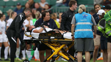 Washington Spirit's Jordan Baggett lies on stretcher during NWSL Challenge Cup Final (Photo by Andy Mead/ISI Photos/Getty Images)