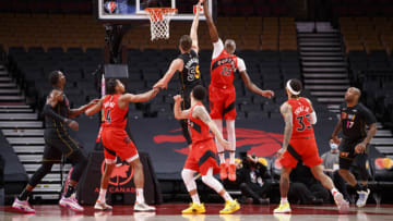 TORONTO, ON - FEBRUARY 01: Chris Boucher #25 of the Toronto Raptors blocks a shot from Duncan Robinson #55 of the Miami Heat (Photo by Cole Burston/Getty Images)