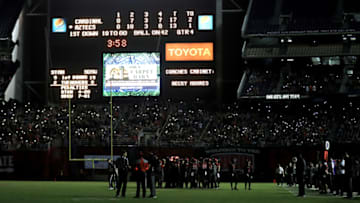 SAN DIEGO, CA - SEPTEMBER 16: Fans and players look on while half of the stadiums lights went out during the second half of a game between the San Diego State Aztecs and the Stanford Cardinal at Qualcomm Stadium on September 16, 2017 in San Diego, California. (Photo by Sean M. Haffey/Getty Images)