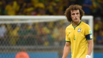 Brazil's defender David Luiz reacts during the semi-final football match between Brazil and Germany at The Mineirao Stadium in Belo Horizonte on July 8, 2014, during the 2014 FIFA World Cup . AFP PHOTO / PEDRO UGARTE (Photo credit should read PEDRO UGARTE/AFP/Getty Images)