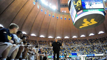 Feb 7, 2015; Morgantown, WV, USA; West Virginia Mountaineers head coach Bob Huggins (center) talks to his team in the first half against the Baylor Bears at WVU Coliseum. Baylor won 87-69. Mandatory Credit: Evan Habeeb-USA TODAY Sports