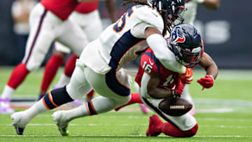 HOUSTON, TX - DECEMBER 8: KeKe Coutee #16 of the Houston Texans is hit after catching a pass and fumbles the ball by Alexander Johnson #45 of the Denver Broncos during the first half at NRG Stadium on December 8, 2019 in Houston, Texas. (Photo by Wesley Hitt/Getty Images)