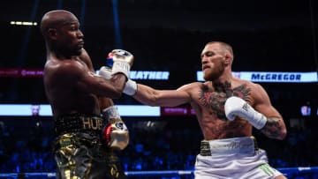 Nevada , United States - 26 August 2017; Conor McGregor, right, and Floyd Mayweather Jr during their super welterweight boxing match at T-Mobile Arena in Las Vegas, USA. (Photo By Stephen McCarthy/Sportsfile via Getty Images)