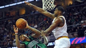 Mar 5, 2016; Cleveland, OH, USA; Cleveland Cavaliers center Tristan Thompson (13) defends against Boston Celtics guard Isaiah Thomas (4) during the fourth quarter at Quicken Loans Arena. The Cavs won 120-103. Mandatory Credit: Ken Blaze-USA TODAY Sports