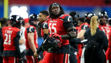 Jan 1, 2021; Atlanta, GA, USA; Cincinnati Bearcats offensive lineman James Hudson (55) shows emotion after being ejected for targeting against the Georgia Bulldogs in the second quarter of the Chick-fil-A Peach Bowl at Mercedes-Benz Stadium. Mandatory Credit: Brett Davis-USA TODAY Sports