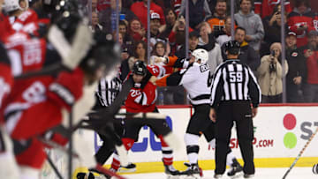 Dec 15, 2022; Newark, New Jersey, USA; New Jersey Devils center Michael McLeod (20) and Philadelphia Flyers left wing Nicolas Deslauriers (44) fight during the second period at Prudential Center. Mandatory Credit: Ed Mulholland-USA TODAY Sports