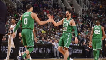 PHOENIX, AZ - MARCH 26: Abdel Nader #28 and Jayson Tatum #0 of the Boston Celtics shake hands during the game against the Phoenix Suns on March 26, 2018 at Talking Stick Resort Arena in Phoenix, Arizona. NOTE TO USER: User expressly acknowledges and agrees that, by downloading and or using this photograph, user is consenting to the terms and conditions of the Getty Images License Agreement. Mandatory Copyright Notice: Copyright 2018 NBAE (Photo by Barry Gossage/NBAE via Getty Images)