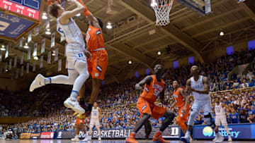 DURHAM, NC - FEBRUARY 11: Luke Kennard #5 of the Duke Blue Devils shoots against Gabe DeVoe #10 of the Clemson Tigers during the game at Cameron Indoor Stadium on February 11, 2017 in Durham, North Carolina. (Photo by Grant Halverson/Getty Images)
