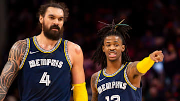 Feb 10, 2022; Detroit, Michigan, USA; Memphis Grizzlies guard Ja Morant (12) talks with center Steven Adams (4) just after the second quarter against the Detroit Pistons at Little Caesars Arena. Mandatory Credit: Raj Mehta-USA TODAY Sports