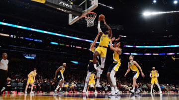 Jan 19, 2022; Los Angeles, California, USA; Los Angeles Lakers forward LeBron James (6) moves to the basket agianst Indiana Pacers forward Domantas Sabonis (11) and guard Jeremy Lamb (26) during the second half at Crypto.com Arena. Mandatory Credit: Gary A. Vasquez-USA TODAY Sports