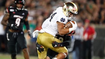 Sep 2, 2019; Louisville, KY, USA; Notre Dame Fighting Irish tight end Tommy Tremble (24) scores a touchdown against the Louisville Cardinals during the third quarter at Cardinal Stadium. Mandatory Credit: Brian Spurlock-USA TODAY Sports