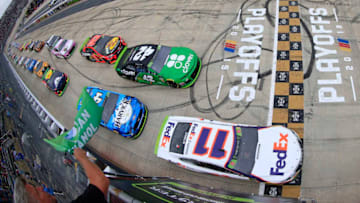 DOVER, DELAWARE - OCTOBER 06: Denny Hamlin, driver of the #11 FedEx Express Toyota, takes the green flag to start the Monster Energy NASCAR Cup Series Drydene 400 at Dover International Speedway on October 06, 2019 in Dover, Delaware. (Photo by Chris Trotman/Getty Images)