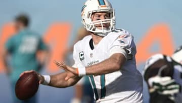 Dec 28, 2014; Miami Gardens, FL, USA; Miami Dolphins quarterback Ryan Tannehill (17) throws a pass in the second half at Sun Life Stadium. The Jets defeated Miami 37-24. Mandatory Credit: Brad Barr-USA TODAY Sports