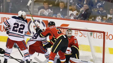 Jan 9, 2017; Winnipeg, Manitoba, CAN; Calgary Flames goalie Chad Johnson (31) makes a save during the second period against the Winnipeg Jets at MTS Centre. Mandatory Credit: Bruce Fedyck-USA TODAY Sports