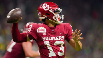 Auburn football Dec 29, 2021; San Antonio, Texas, USA; Oklahoma Sooners quarterback Caleb Williams (13) throws a pass during the first half of the 2021 Alamo Bowl against the Oregon Ducks at the Alamodome. Mandatory Credit: Daniel Dunn-USA TODAY Sports