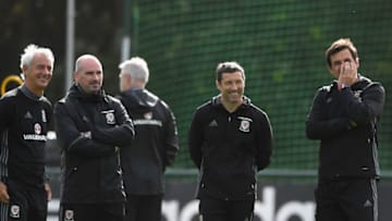 CARDIFF, WALES - OCTOBER 02: Wales coach Chris Coleman (r) and his coaching staff share a joke with Ian Rush (l) look on during Wwales training ahead of their World Cup Qualifiers at Vale Hotel on October 2, 2017 in Cardiff, Wales. (Photo by Stu Forster/Getty Images)
