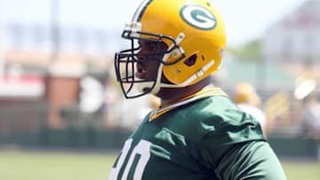 May 22, 2012; Green Bay, WI, USA; Green Bay Packers defensive tackle B.J. Raji (90) during the Green Bay Packers organized team activities at Ray Nitschke Field. Mandatory Credit: Mary Langenfeld-USA TODAY Sports